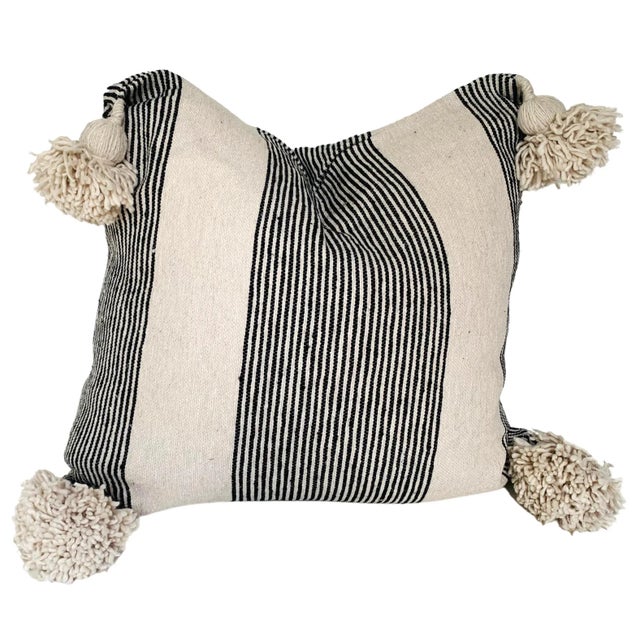 Moroccan handloomed cotton pom-pom pillow with zipper closure. New duck feather-and-down fill inserts. Pattern on front is...