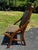 This is an Eastlake style Victorian folding chair circa mid-late 19th century. The wood chair features a curved headrest...