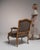 This piece presents as a dining chair, distinguished by taupe/gray fabric upholstery, brass nailhead trim. Originating in...