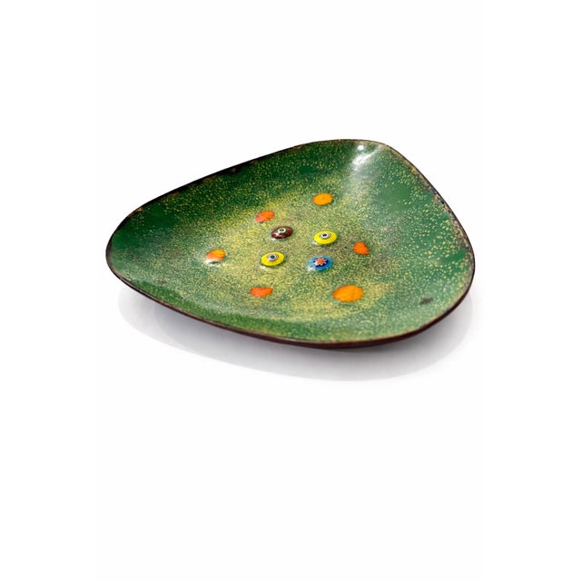 Striking handmade enamel-on-metal dish with an organic, freeform triangular shape. The interior features a richly speckled...