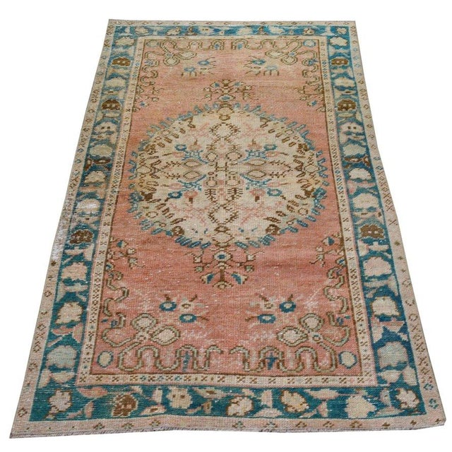 Hand-knotted with care using traditional rug-making techniques, this wool rug blends timeless craftsmanship with a modern...