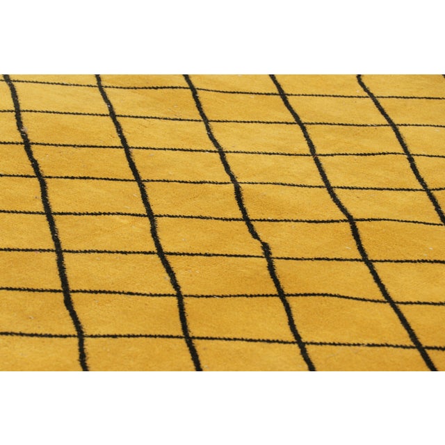 Hand-knotted in wool and originating from Turkey circa 1960 – 1970, this 5x8 vintage Zeki Müren rug is a unique addition...