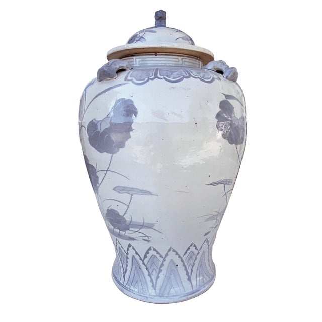 This large hand-painted urn features a rare and beautiful blend of pale cornflower blue and gray tones, a unique color...