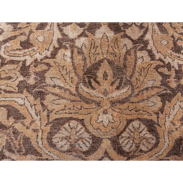 A late 19th century Indian Amritsar antique rug, the camel field with a large-scale design with an enlarged palmette and...