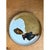 This vintage stoneware plate presents a bold, abstract glaze composition, with a creamy, unglazed white body serving as...