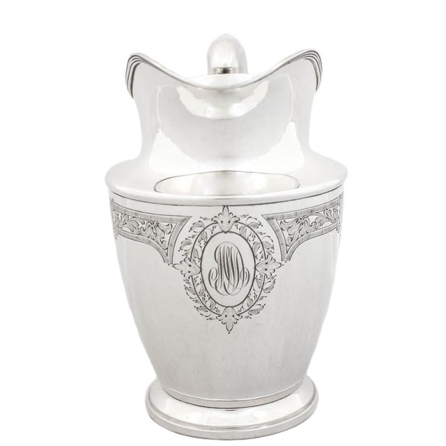 We are delighted to offer you this sterling silver water pitcher by the Schofield Silver Co of Baltimore, Maryland. It is...