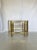Vintage nest of three tables. The frames are in brass and each table has a smoked glass top. Very elegant and in true...