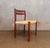 An authentic Danish Modern dining chair by Børge Mogensen for J.L. Møller, crafted in solid teak with clean Scandinavian...