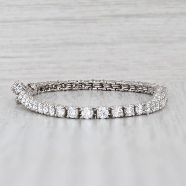 Gemstone Information: - Natural Diamonds - Total Carats - 5.60ctw Cut - Round Brilliant Color - F - G Clarity - VS2 Metal:...