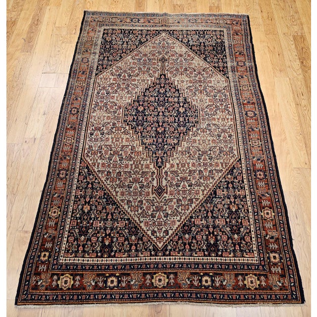 "An exceptional late 19th century Persian Senneh rug, crafted by Kurdish artisans in Western Persia with the extraordinary...