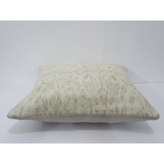 Decorative pillow cover made from a vintage Turkish handknotted rug. Backed with good quality cotton fabric. Pillow...