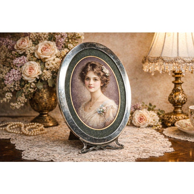 This elegant antique Art Nouveau sterling silver picture frame is a refined example of turn-of-the-century design,...