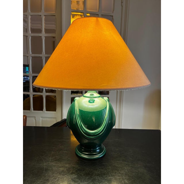 Neo-classical style lamp with a green ceramic base, 1970s Base height 30cm, diameter 22cm Lampshade needs replacing This...
