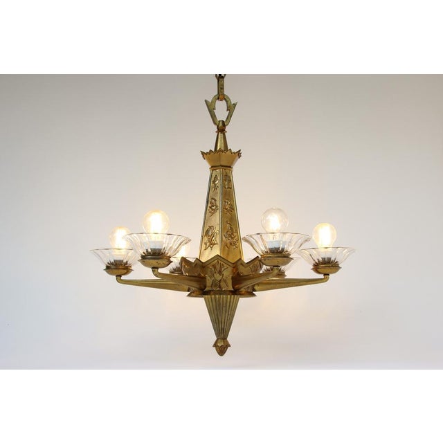 Dagobert peche style chandelier, made in austria or germany in the 1920s. solid brass body (cast and stamped) with floral...