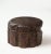 The circular box and conforming cover carved in realistic detail, with grainy texture and undulating bark-like sides,...