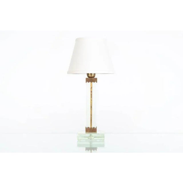 ARTURO PANI (1915 - 1981) Custom table lamp with central bronze column flanked by two panes of crystal raised on a square...