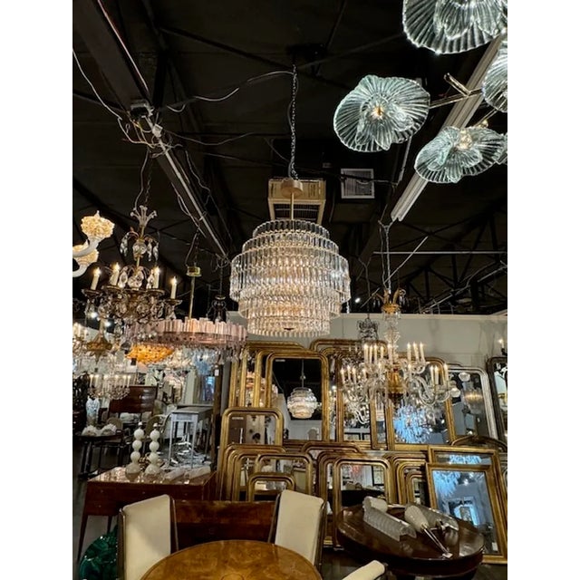 Gorgeous modern multi-tiered Murano glass and brass chandelier. A glistening beauty that make a real statement! Stunning...