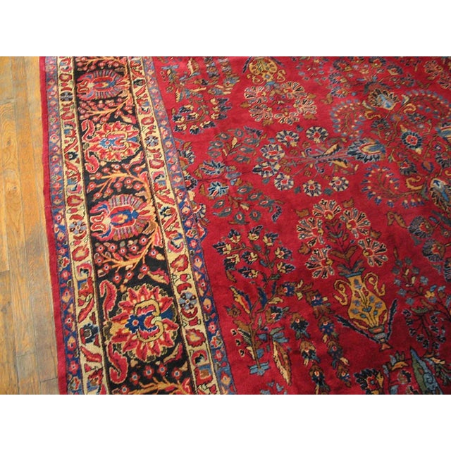 Antique Sarouk Coral 1920s Rug, Circa Date: 1920s. This exceptional example of a classic Sarouk weaving, dating from the...