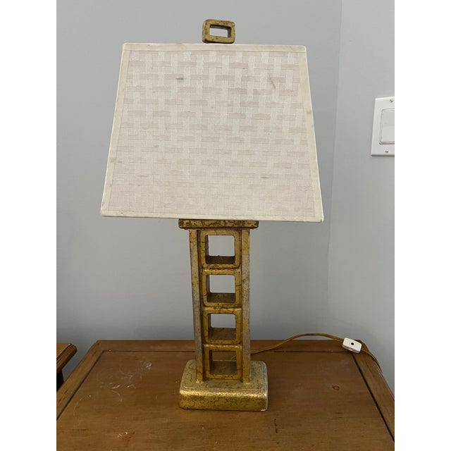 Beautiful Geometric Block Shape Table lamp. Has a goldy bronze color.