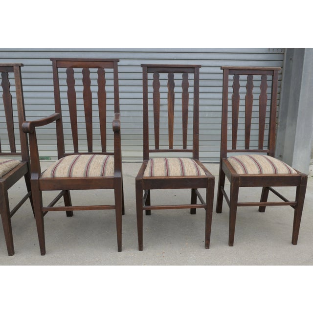Set of 6 Arts and Crafts Oak Dining Chairs This is a very handsome set of Oak Chairs, 5 dining chairs and one carver The...
