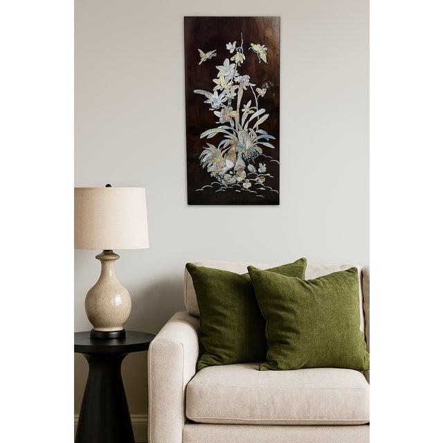 A striking mid-20th century Vietnamese lacquer panel exquisitely inlaid with mother-of-pearl. This large decorative plaque...