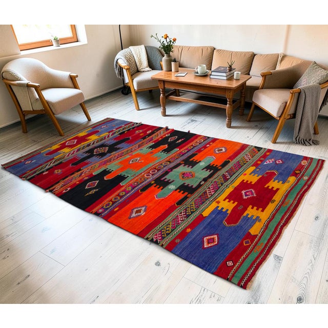 Woven in the 1960s in the Sivas region of Central Anatolia, this striking flatweave kilim exemplifies the expressive...