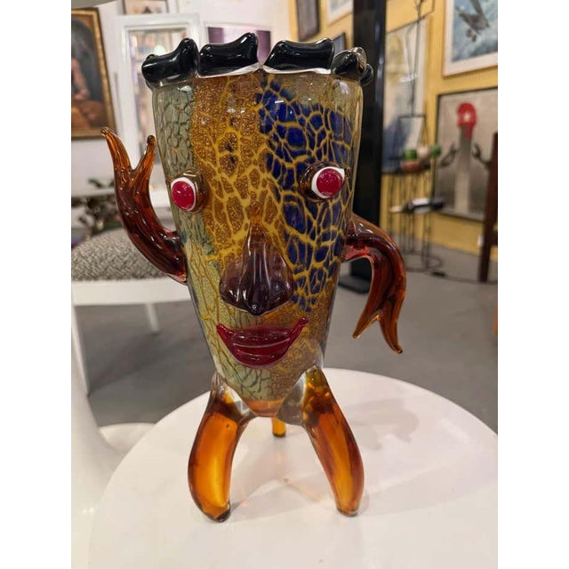 Whimsical and bold, this handcrafted glass sculpture captures the joyful energy of mid-century Italian glass art. The...