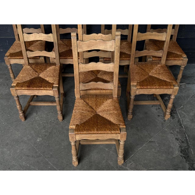 A nice set of French Oak Farmhouse Dining Chairs with rush seats. All are strong and sturdy. We have bleached them for a...