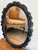 Pretty black resin mirror with the look of carved wood. This mirror is lightweight and ready to hang. Please see condition...