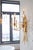 Gold leaf over iron with wrapped metal accents and electrified candles. 26.5h x 22.5w x 12d