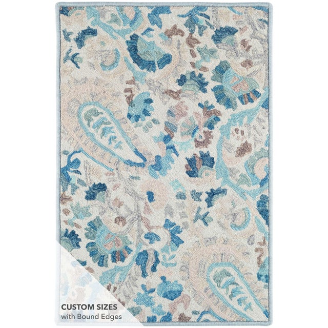 Add sophisticated color and pattern to your bedroom, living room, or dining room floor with this micro-hooked wool rug. A...