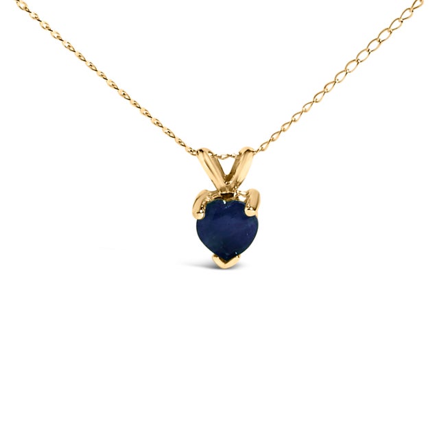 Evoke the essence of eternal elegance with this captivating pendant necklace, featuring a heart-shaped sapphire, a symbol...