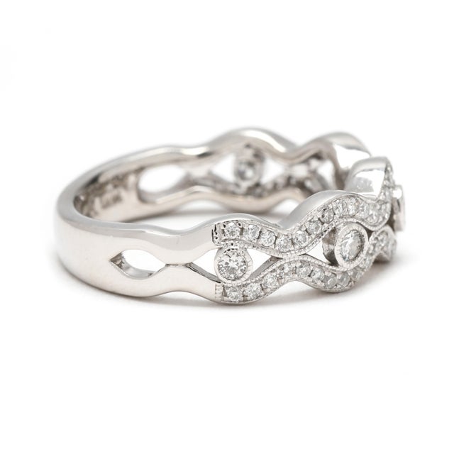 Stones: diamond round brilliant cut 1-2 mm approximately .50 total carats GH color/ SI1-2 clarity Ring Size 6.75 Rise off...