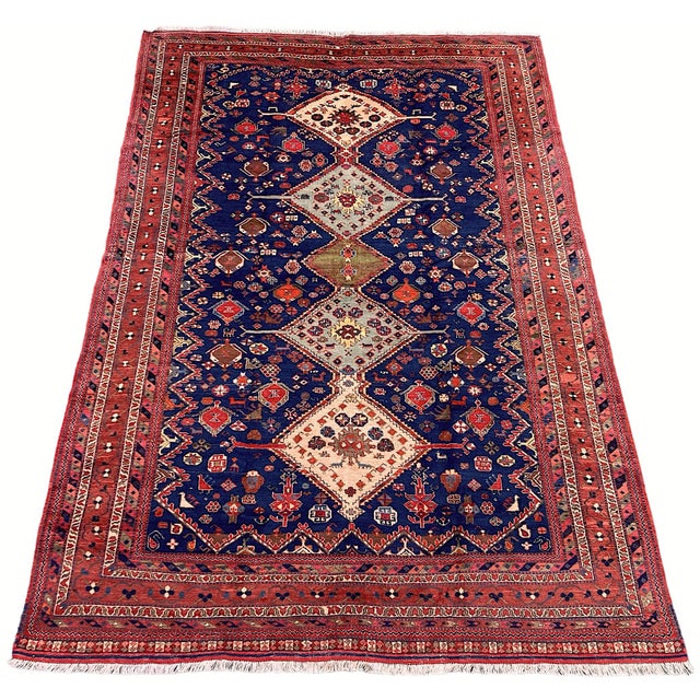 A lovely vintage Afshar rug, handwoven circa 1940. The design features 5 geometrical medallions on a rich indigo field of...
