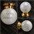 This ceiling light fixture features a frosted glass shade with an etched floral design and a brass metal mounting base. A...
