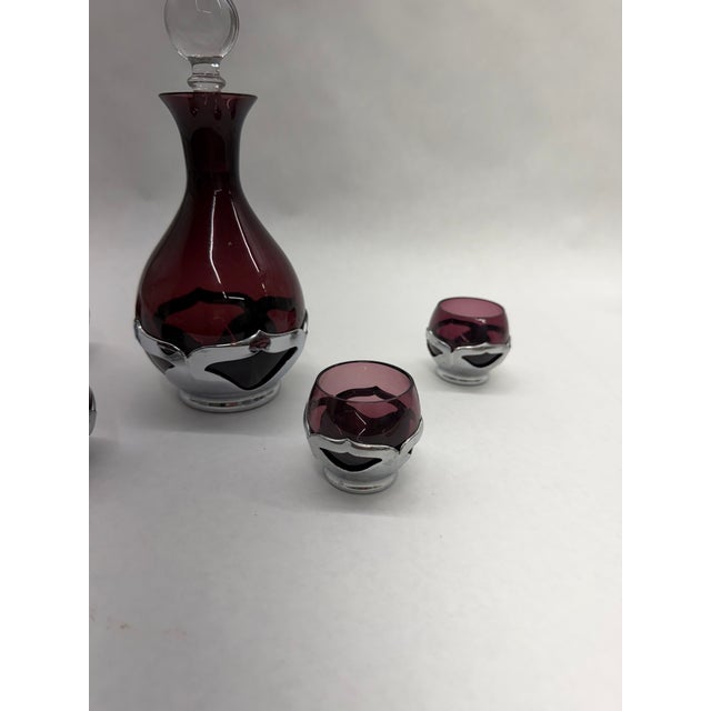 Bring classic mid-century elegance to your home bar with this Vintage Silver Overlay Glass Decanter set. Crafted from deep...