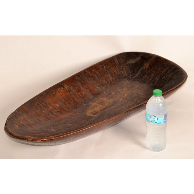 This African Tribal hand carved bowl is a traditional vessel made entirely by skilled artisans using natural hardwoods...