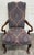 This is a gorgeous vintage Queen Anne style library chair crafted with a richly finished mahogany frame featuring graceful...