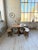 A set comprising a round solid oak table and two rounded pine benches, perfectly complementing the table. Dating from the...