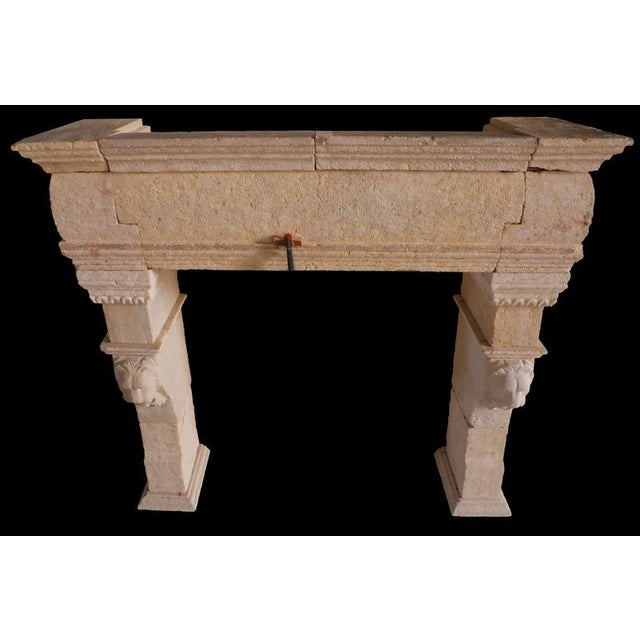 A bold and commanding architectural statement, this 20th-century French limestone fireplace surround is distinguished by...