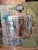 A superior vintage mid century modern silvered ice bucket barware in the style of christofle. Having it's original mercury...