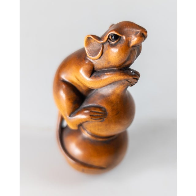 We are selling this 20th century Japanese carved Boxwood netsuke. This netsuke is very well carved with a rat perched on a...