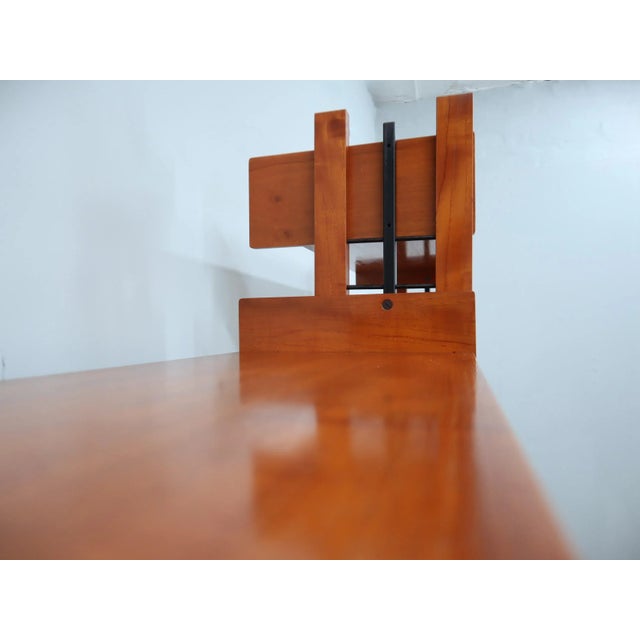 An elegant 1960s teak modular bookcase manufactured by av arredamenti, representing a perfect balance between...