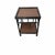 Vintage black two tier bamboo two tier table. A wood underlay supports a brown woven rattan herringbone pattern on the top...