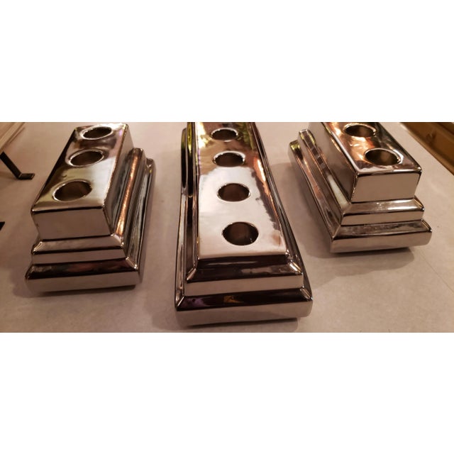 These are very old but in beautiful condition. Each hold 3 stick candles. Ceramic with high polished chrome finish . These...