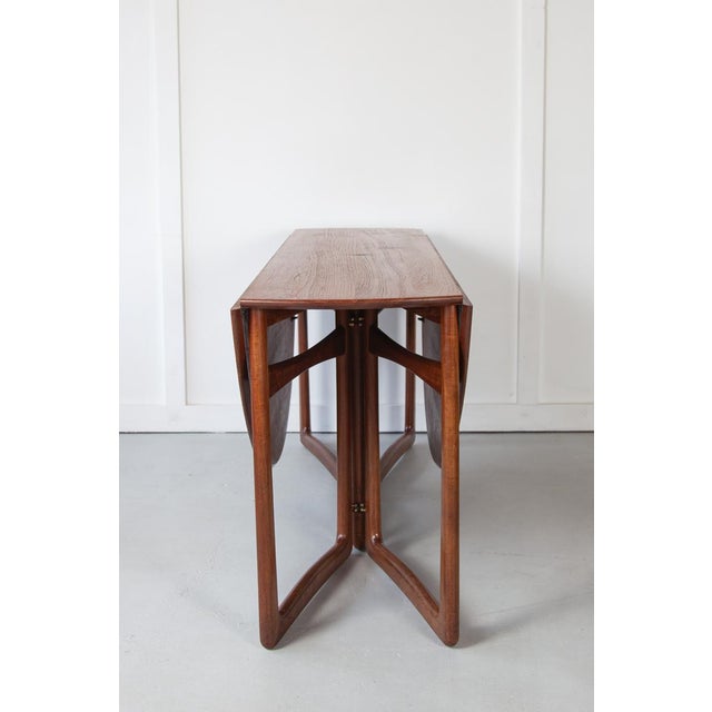 Model FD20/59 solid teak gate-leg dining table with brass fittings designed by Peter Hvidt & Orla Mølgaard-Nielsen for...