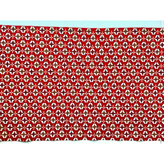 Vintage red silk blend graphic flowers with white and orange accents. 14 in wide x 6.5 yards no odor.