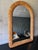 A beautifully crafted vintage pencil reed wall mirror featuring a timeless arched silhouette and finely wrapped reed...