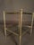 Elegant French mid-20th-century small side table, circa 1950, featuring a refined nickel-plated bronze frame and two tiers...