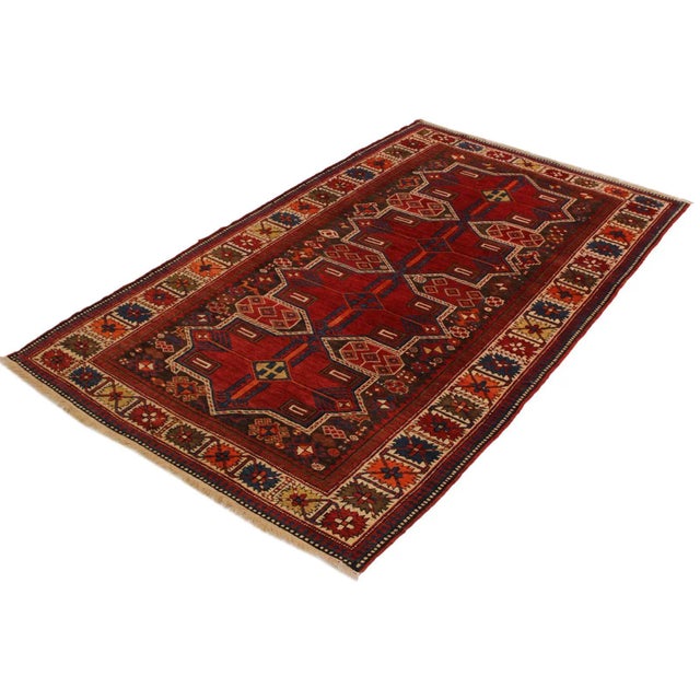 Enjoy the uniqueness of this authentic one-of-a-kind antique Baku rug, hand-knotted by skillful weavers in Baku...